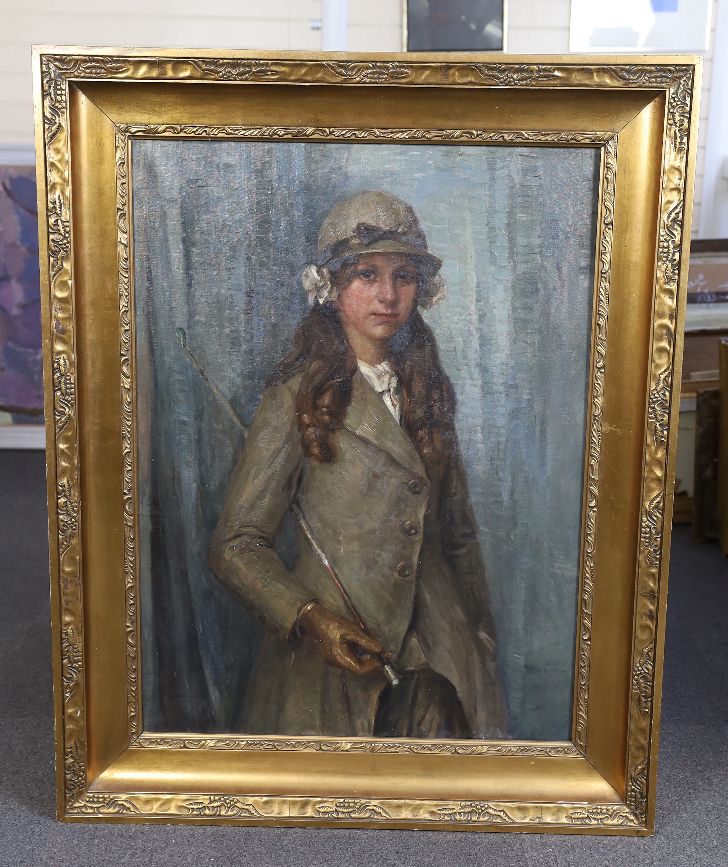 English School c.1900 , Three quarter length portrait of a young woman in riding attire, oil on canvas, 98 x 72cm